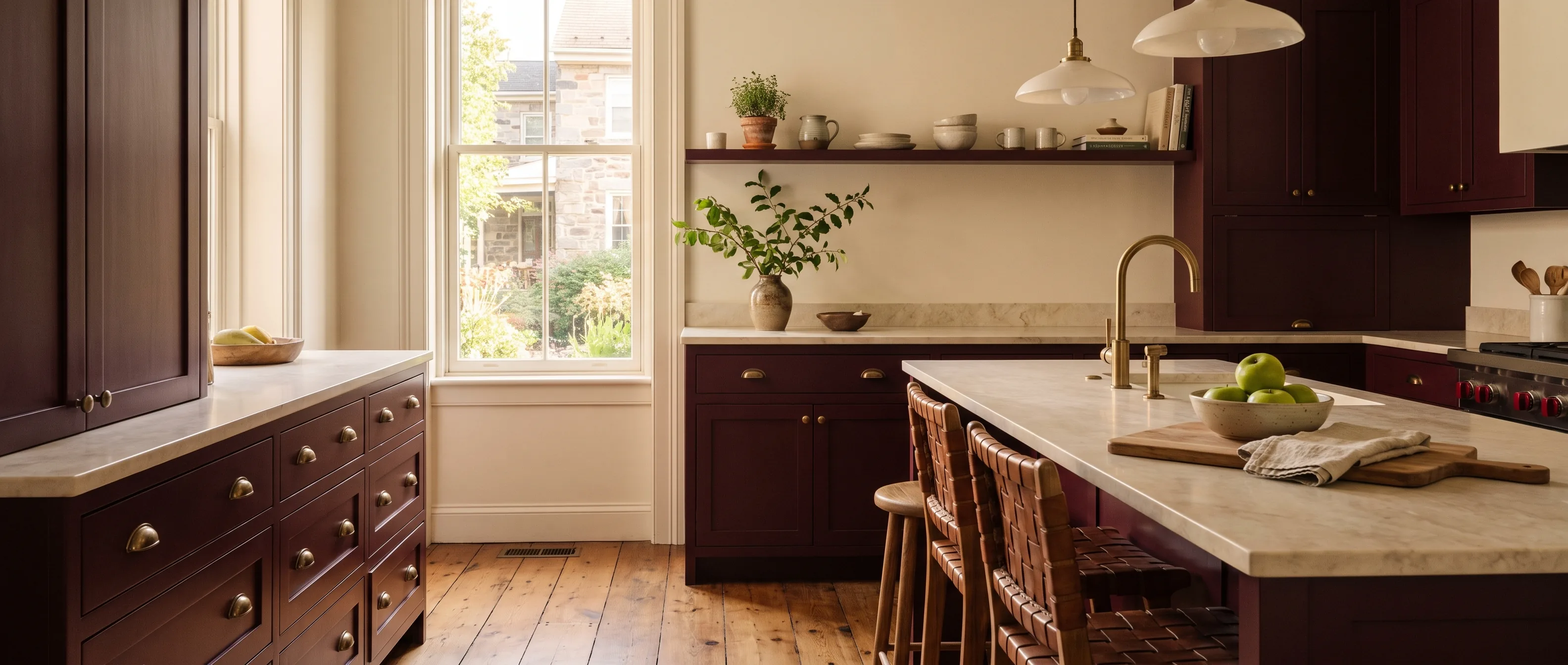 Kitchen remodel in Bethlehem, PA — rich burgundy-merlot inset-shaker cabinetry, honed-marble counters, antique-brass cup pulls | VM Power Kitchen & Bath