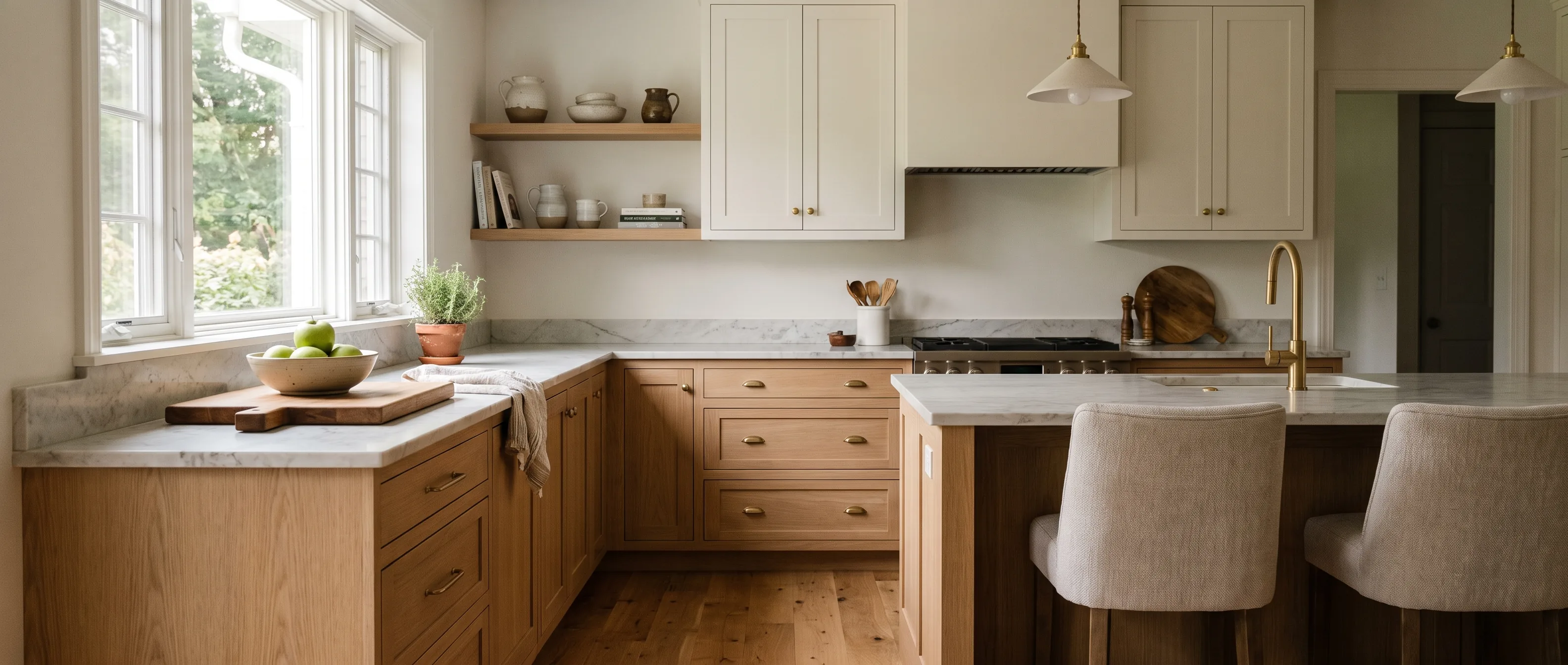 Kitchen remodel in Lopatcong, NJ — natural white-oak and warm-white two-tone cabinetry, honed marble counters, brass hardware | VM Power Kitchen & Bath